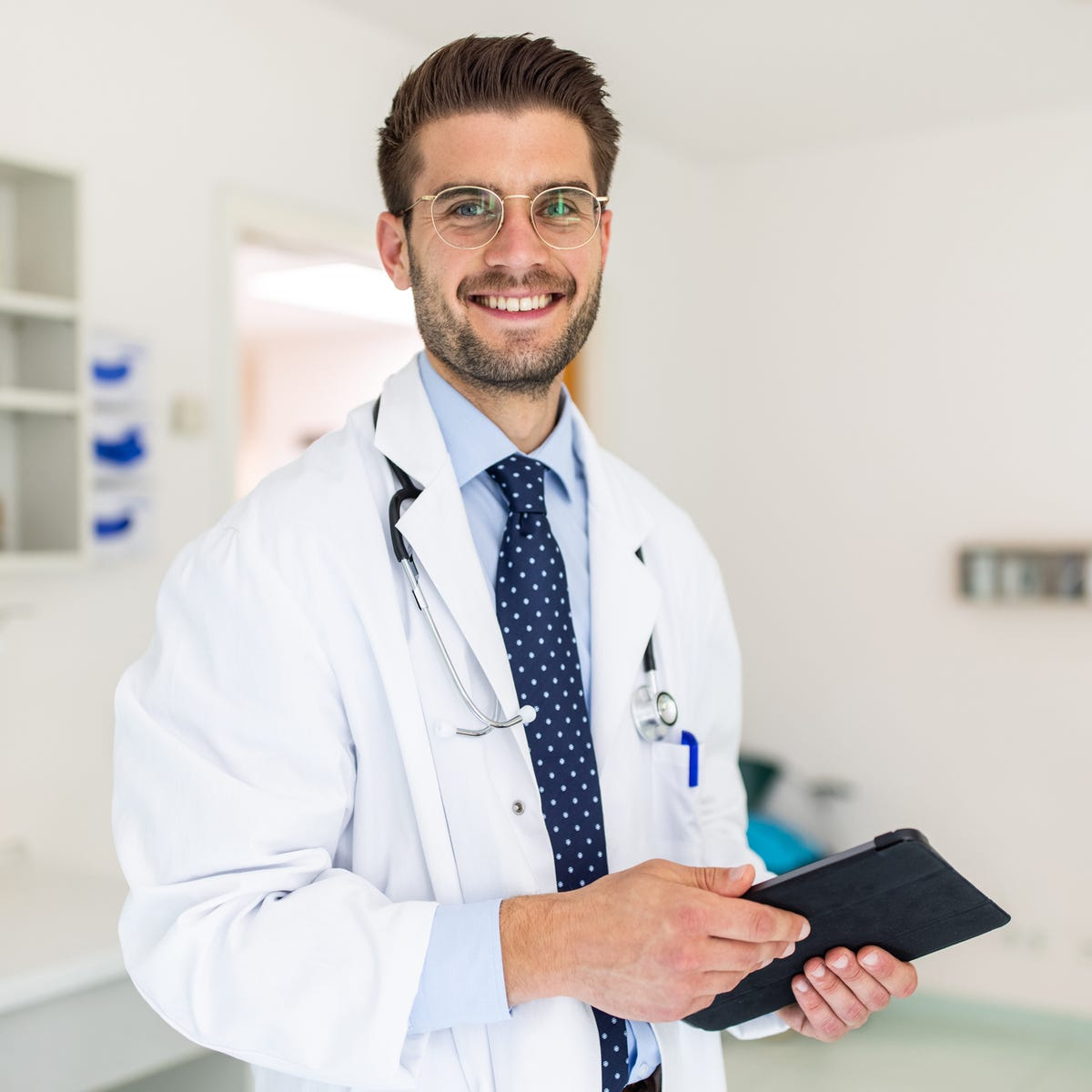 files/portrait-of-a-happy-young-doctor-in-his-clinic-royalty-free-image-1661432441.png